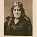 a woman with long hair and costume jewelry