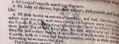 A paragraph of printed text, a woodcut image from the previous page showing through.