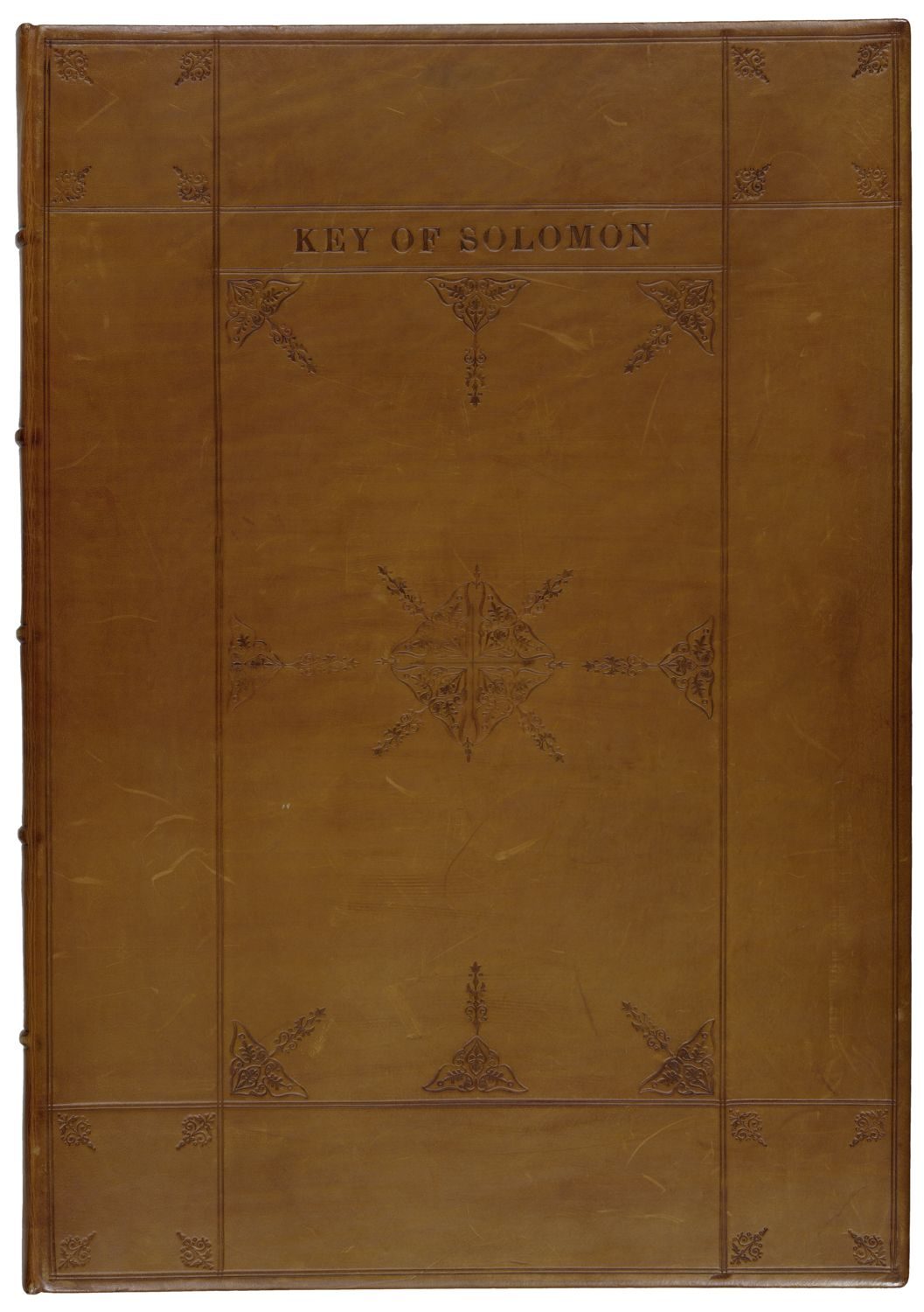 A brown leather cover of a book with the title and some simple floral figures on it.