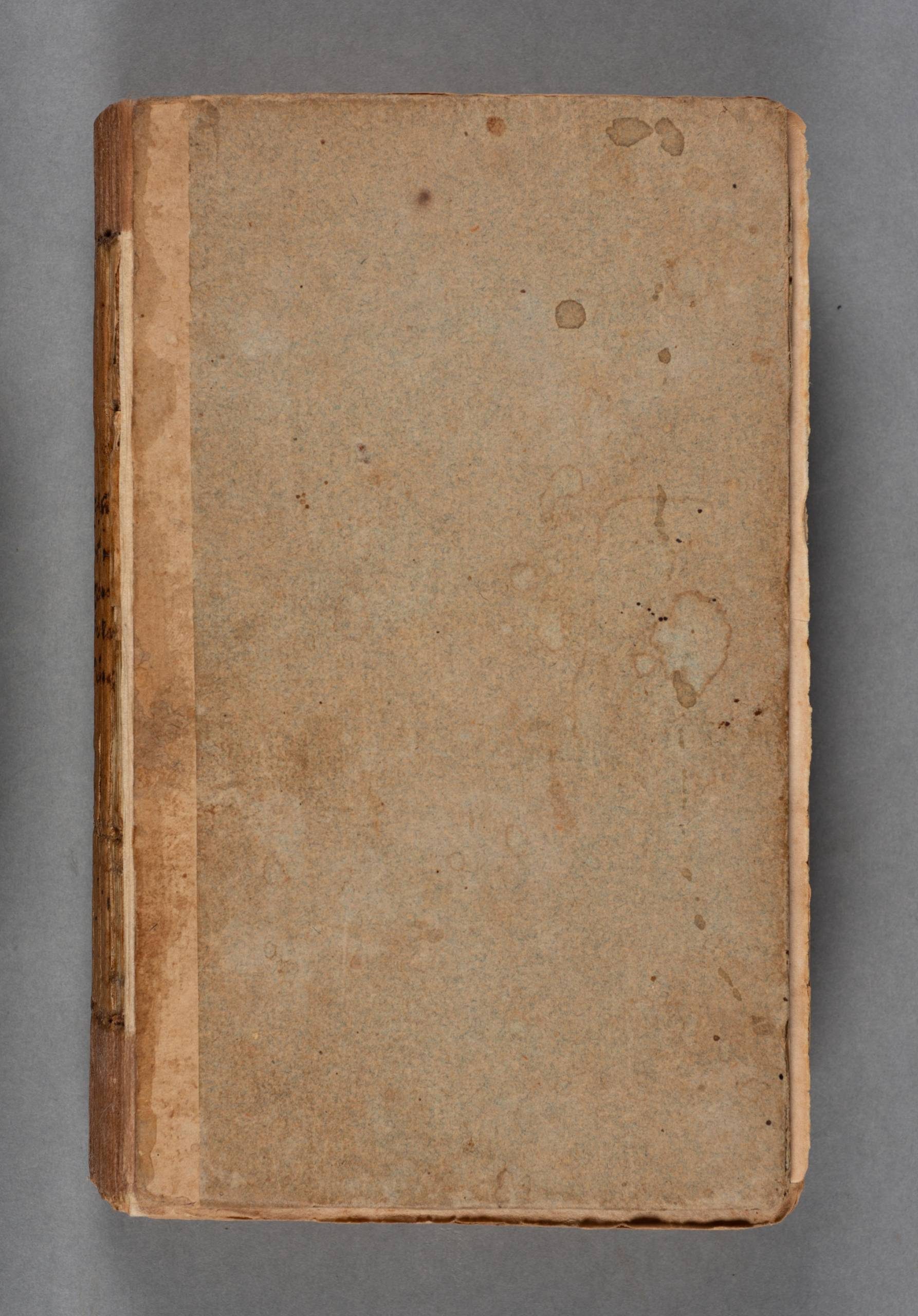 A plain faded blue-green cover of a closed book