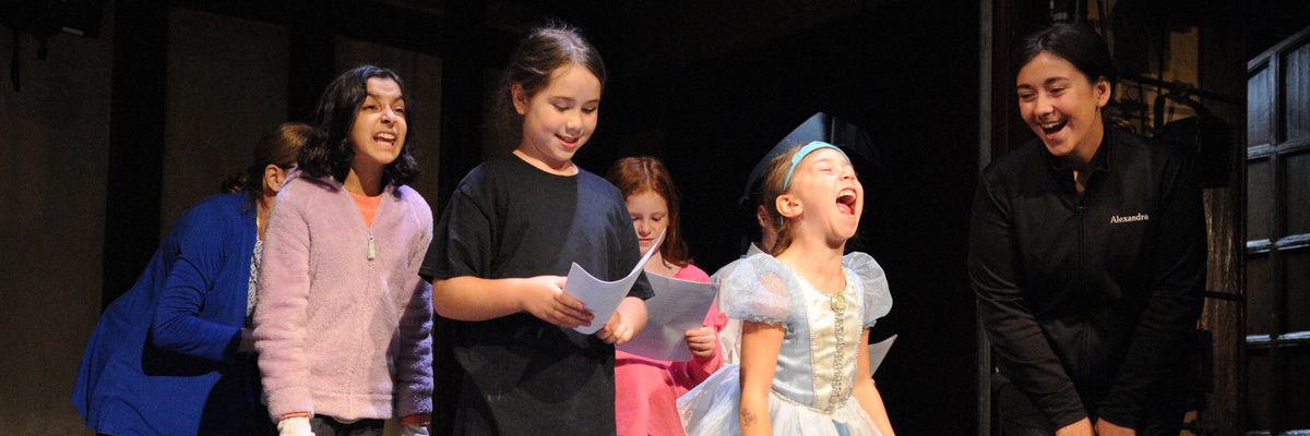 Children acting on a theater stage