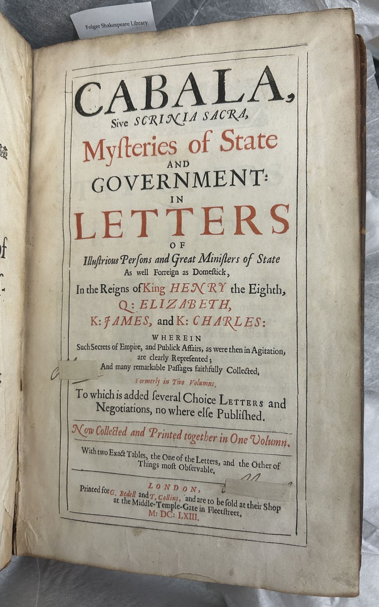 A printed title page with some of the words printed in red ink.