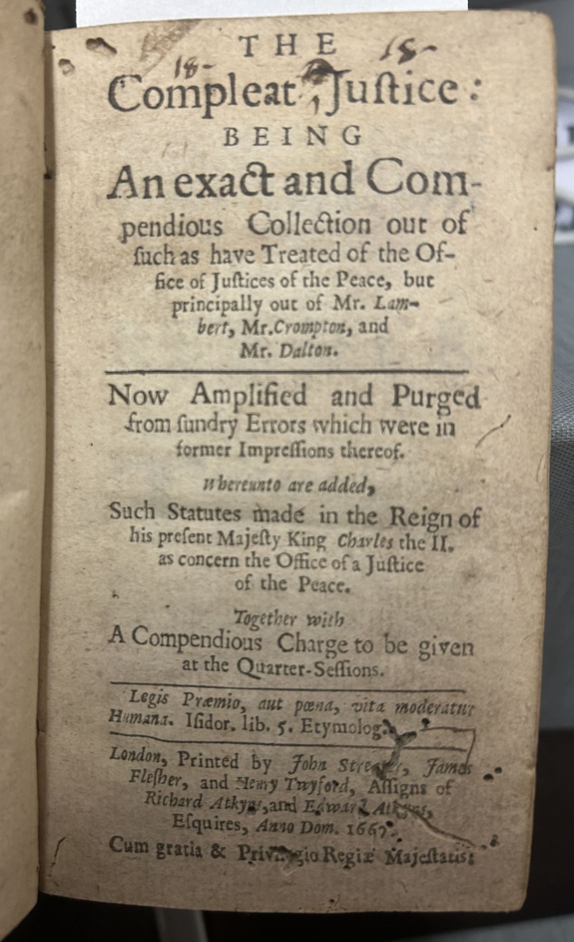 A printed title page with a little bit of handwritten text at the top