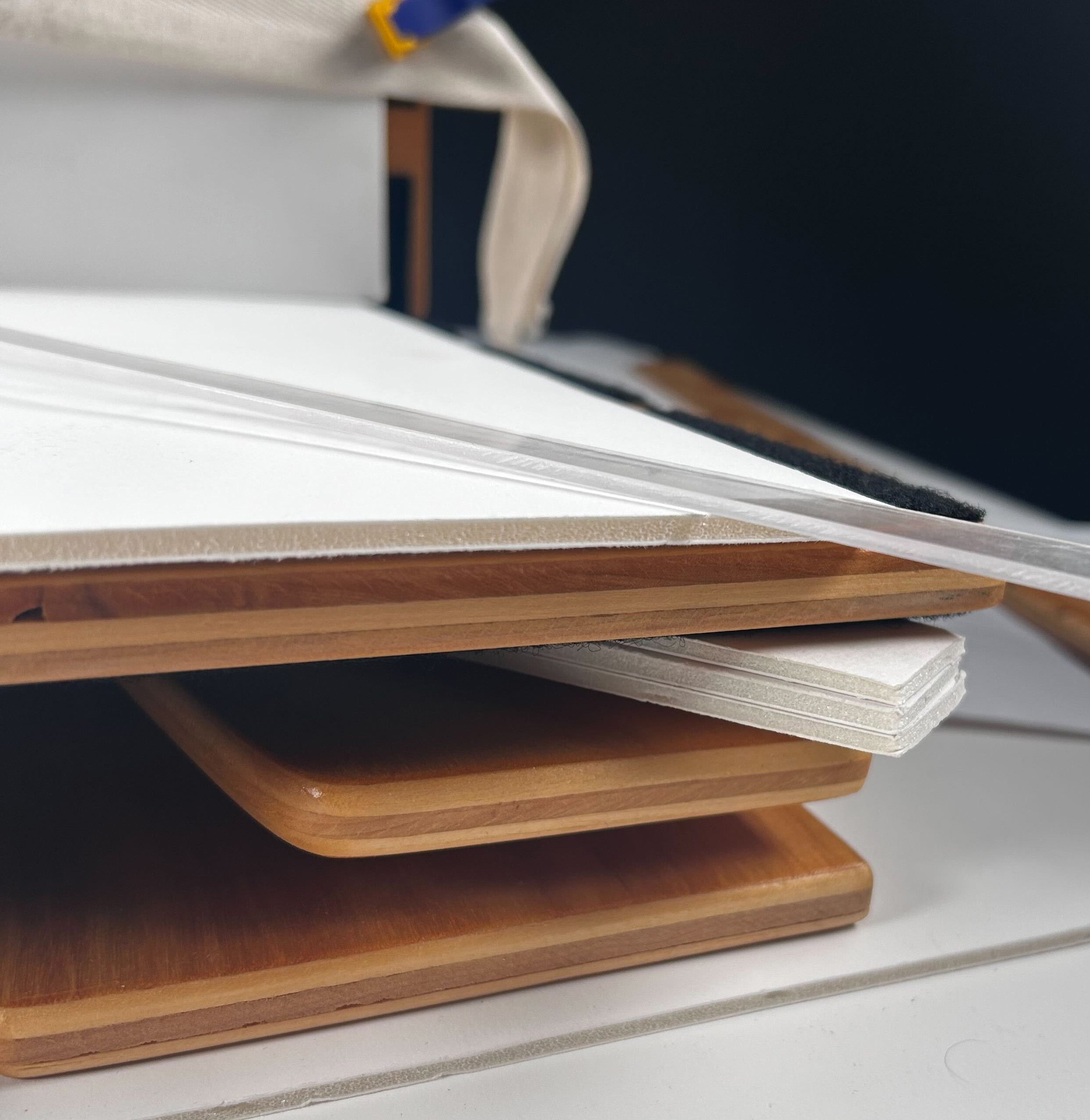A close up of wooden supports with foam inbetween